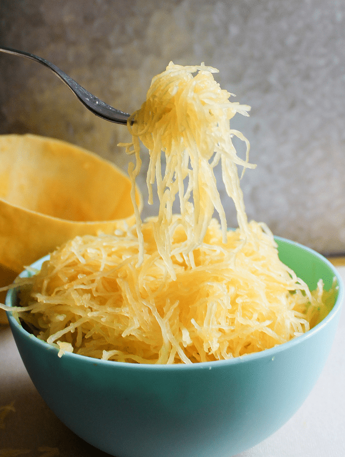 Cooking spaghetti squash in the instant pot is so simple you may just wonder why it took you so long to try it out! #spaghettisquash #instantpotrecipes