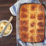 an overhead shot of keto Hawaiian sweet rolls with butter to the side.