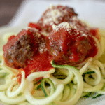 Homemade meatballs and marinara on top of zucchini noodles