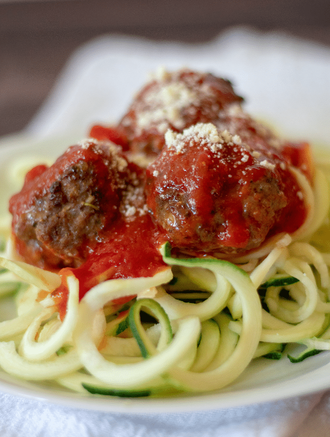 Homemade meatballs and marinara on top of zucchini noodles