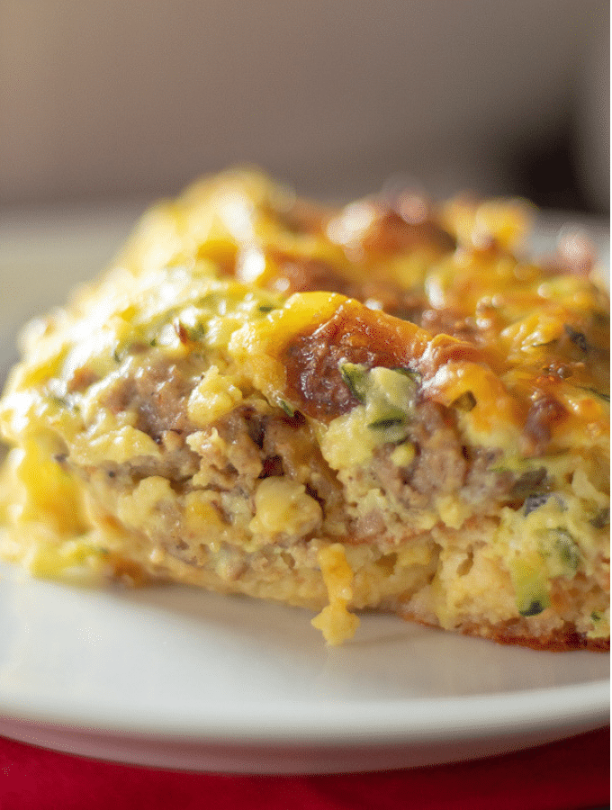 A slice of low carb breakfast casserole on a white plate