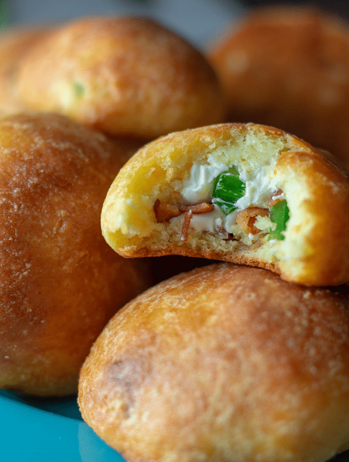 A stack of keto fathead dough balls filled with jalapeños, bacon, and cream cheese