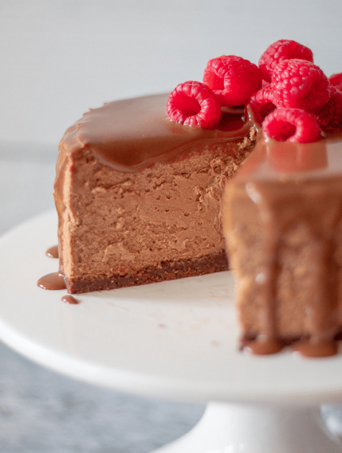 keto chocolate cheesecake with one slice missing 