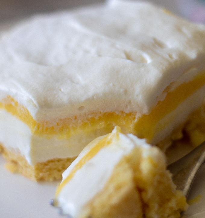 triple layer keto lemon dessert on a white plate