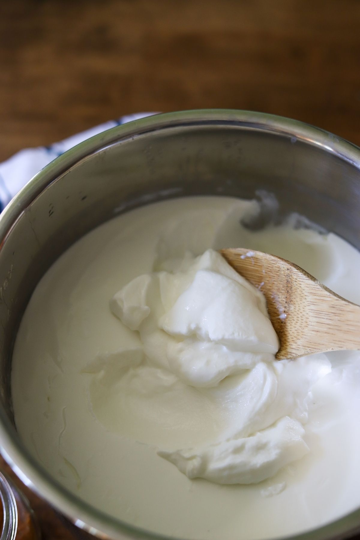 homemade yogurt in an instant pot liner being stirred
