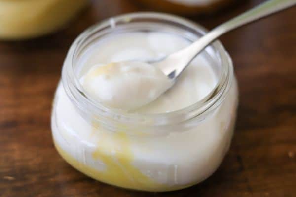 Homemade low carb lemon yogurt in a small glass jar