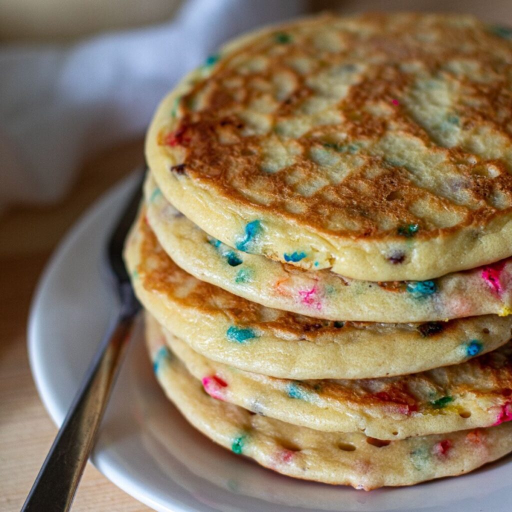 a stack of birthday cake pancakes without syrup