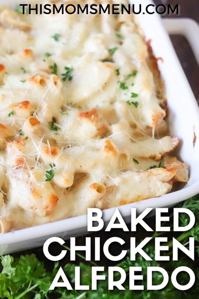 A close up of Chicken Alfredo Casserole baked in a white dish and topped with fresh parsley and a white text overlay that says "Baked Chicken Alfredo"