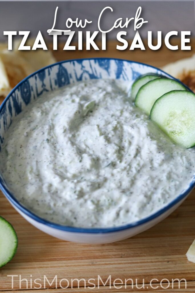 Greek Tzatziki sauce in a bowl with sliced cucumber and text overlay.