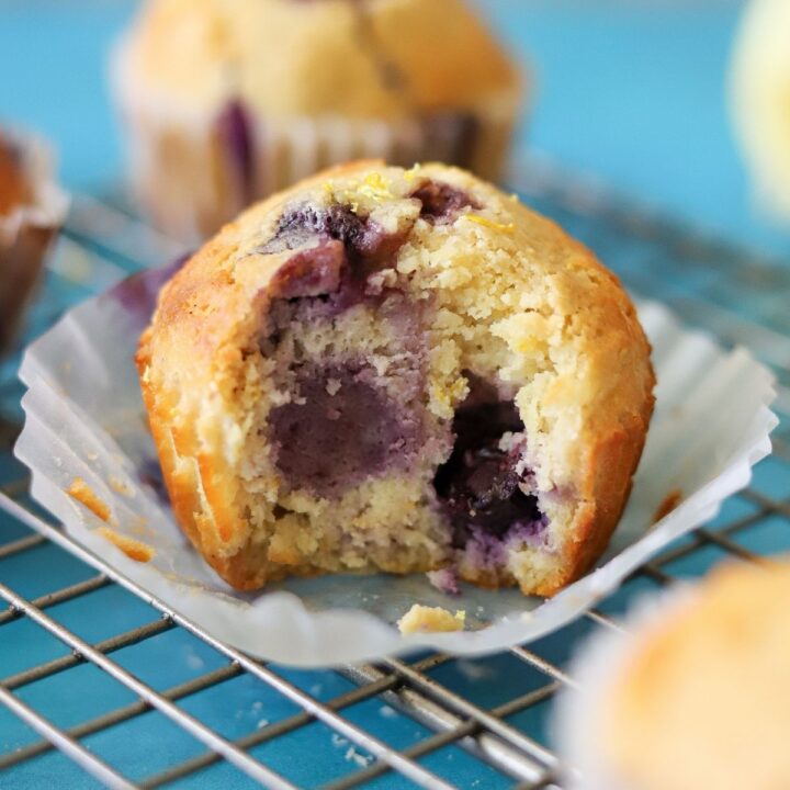 a healthy blueberry muffin with one bite taken
