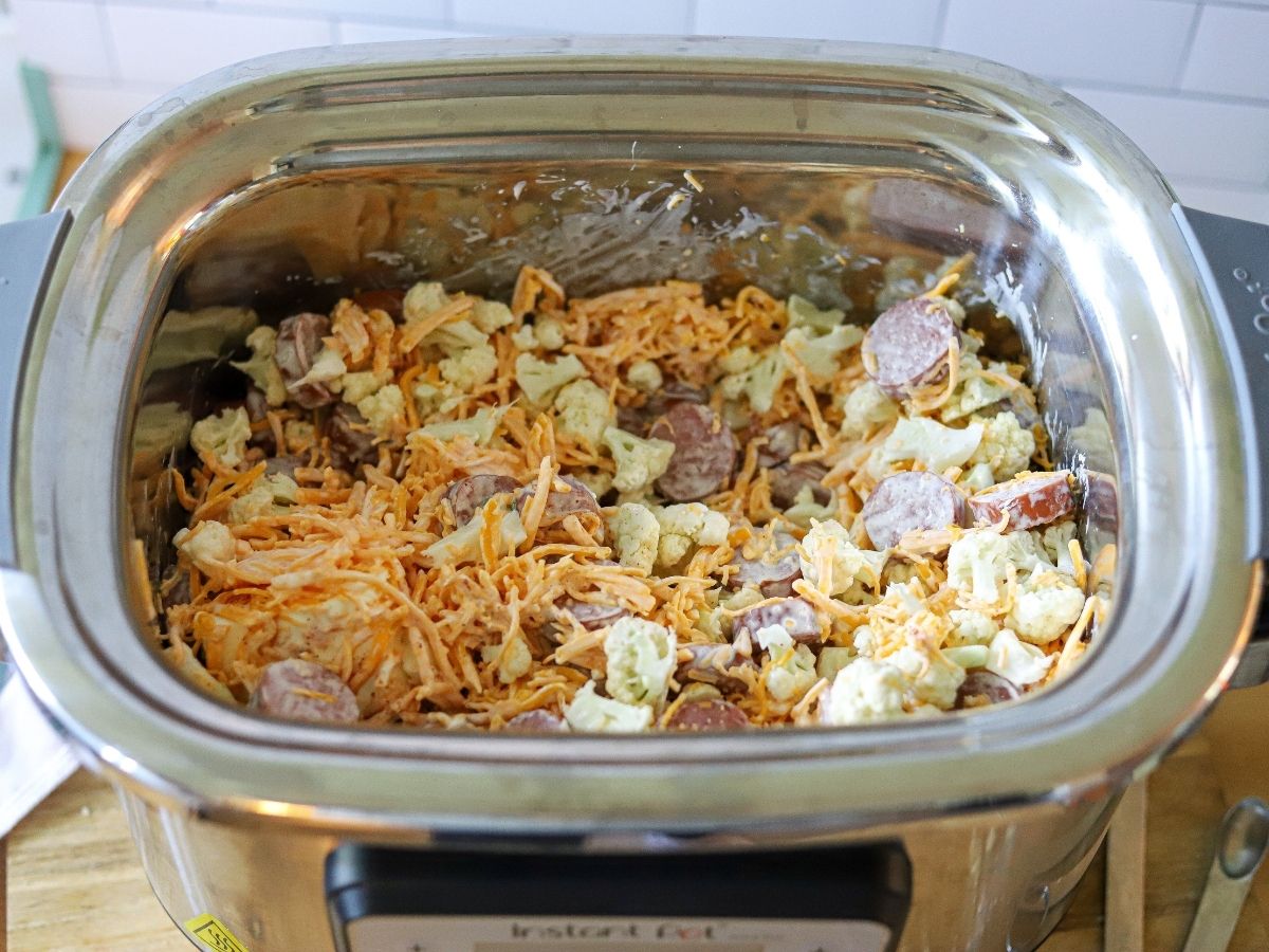 smoked sausages, cheese, cream cheese, and cauliflower in a crockpot