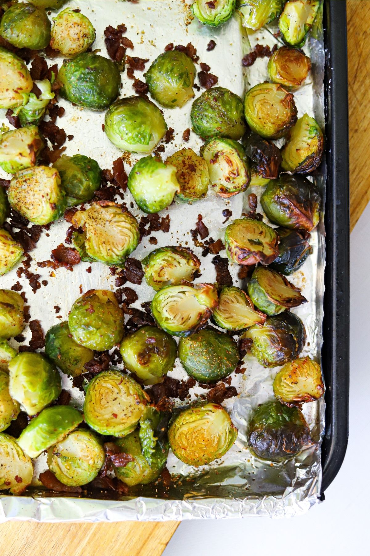 roasted brussels sprouts and bacon on a sheet pan