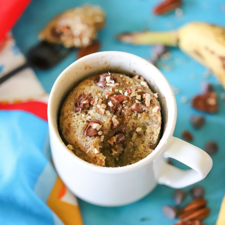 Banana bread in a mug with chocolate chips and pecans