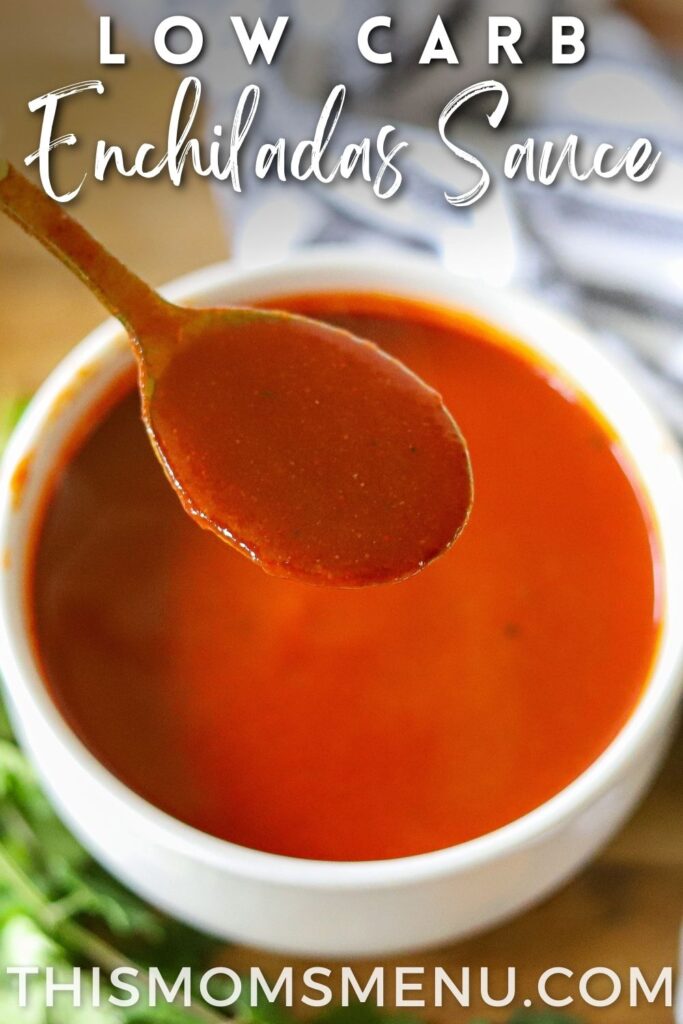 homemade enchilada sauce being served with a golden spoon