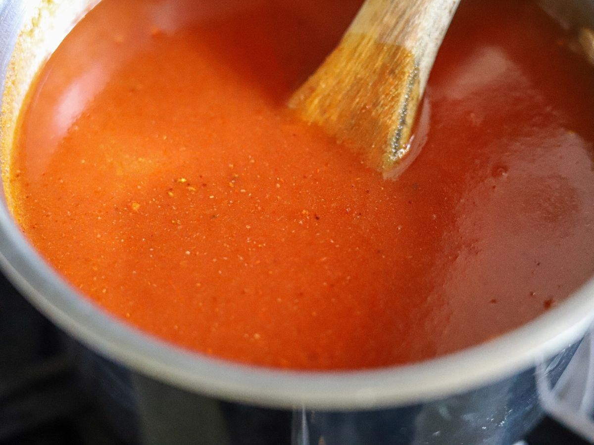 low carb enchilada sauce cooking in a saucepan