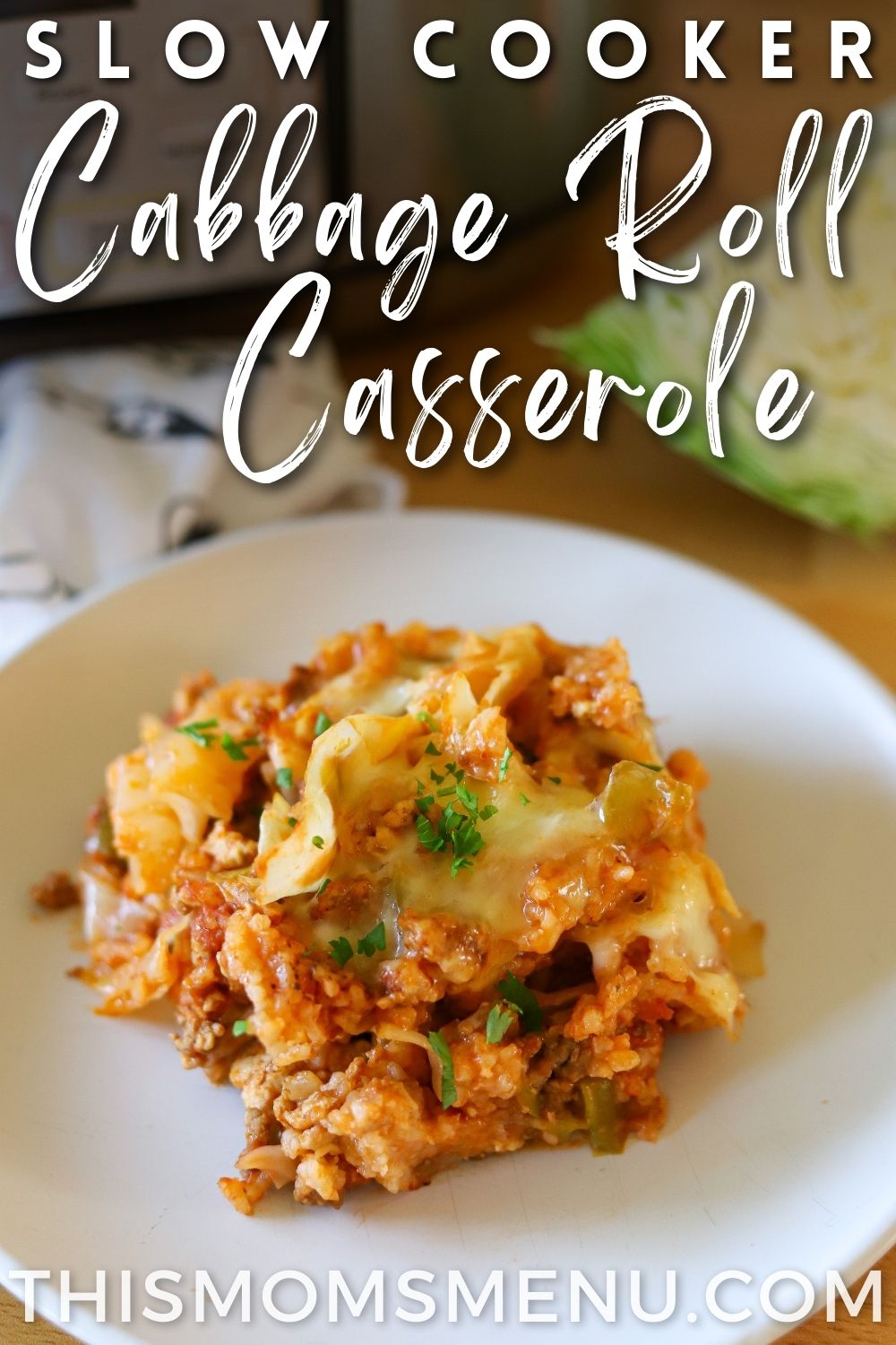 A serving of cabbage roll casserole on a white plate with a text overlay.