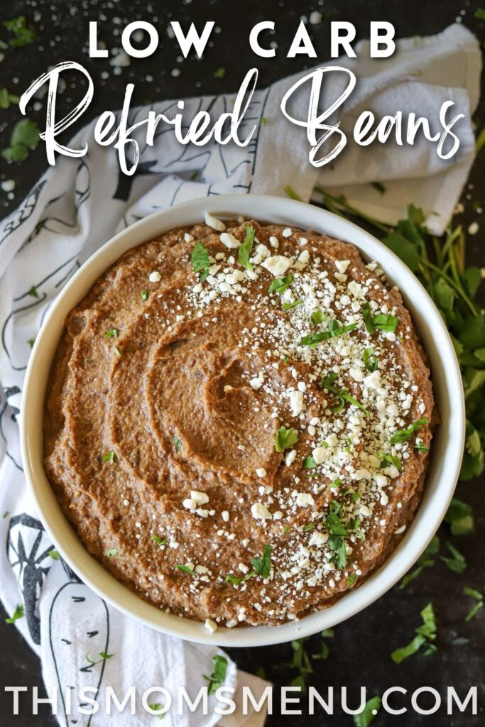 a bowl filled with low carb refried beans with text overlay