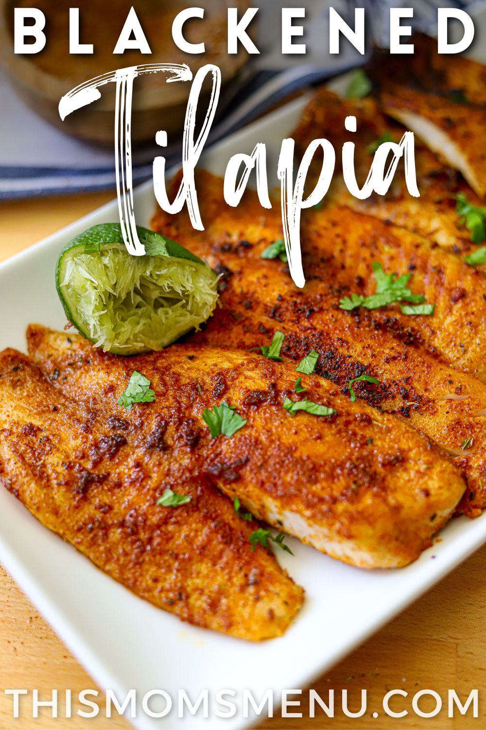 blackened fish fillets on a white plate with text overlay