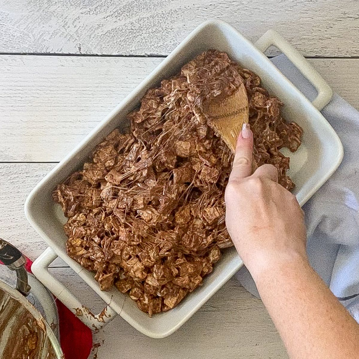 s'more bars being spread out into a baking dish