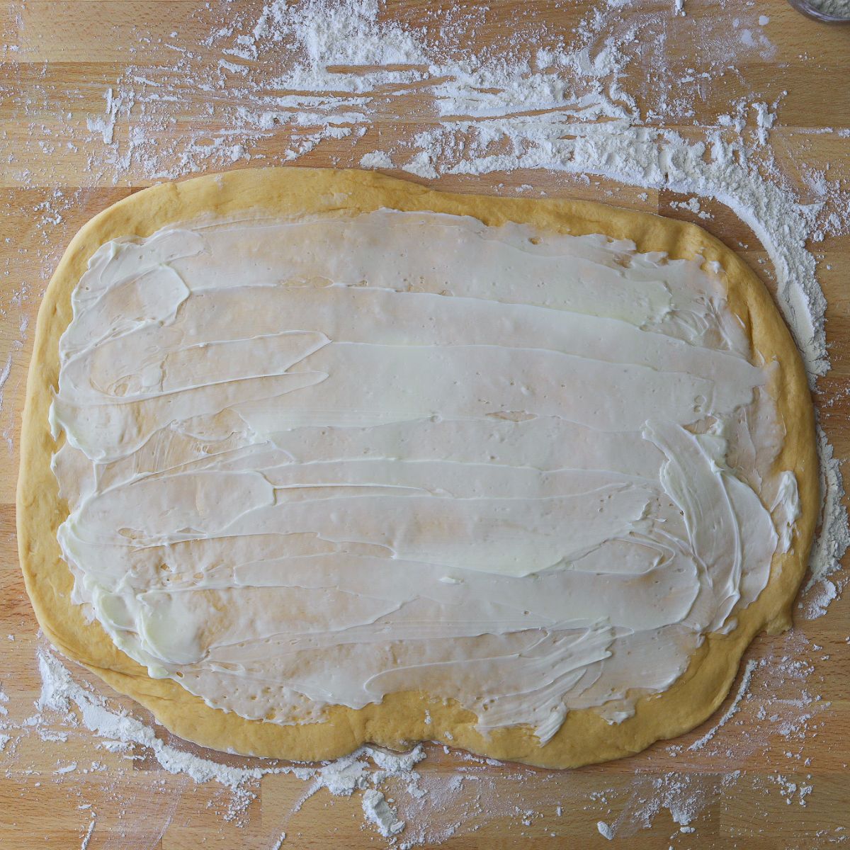 dough rolled out into a rectangle and coated in a layer of butter.