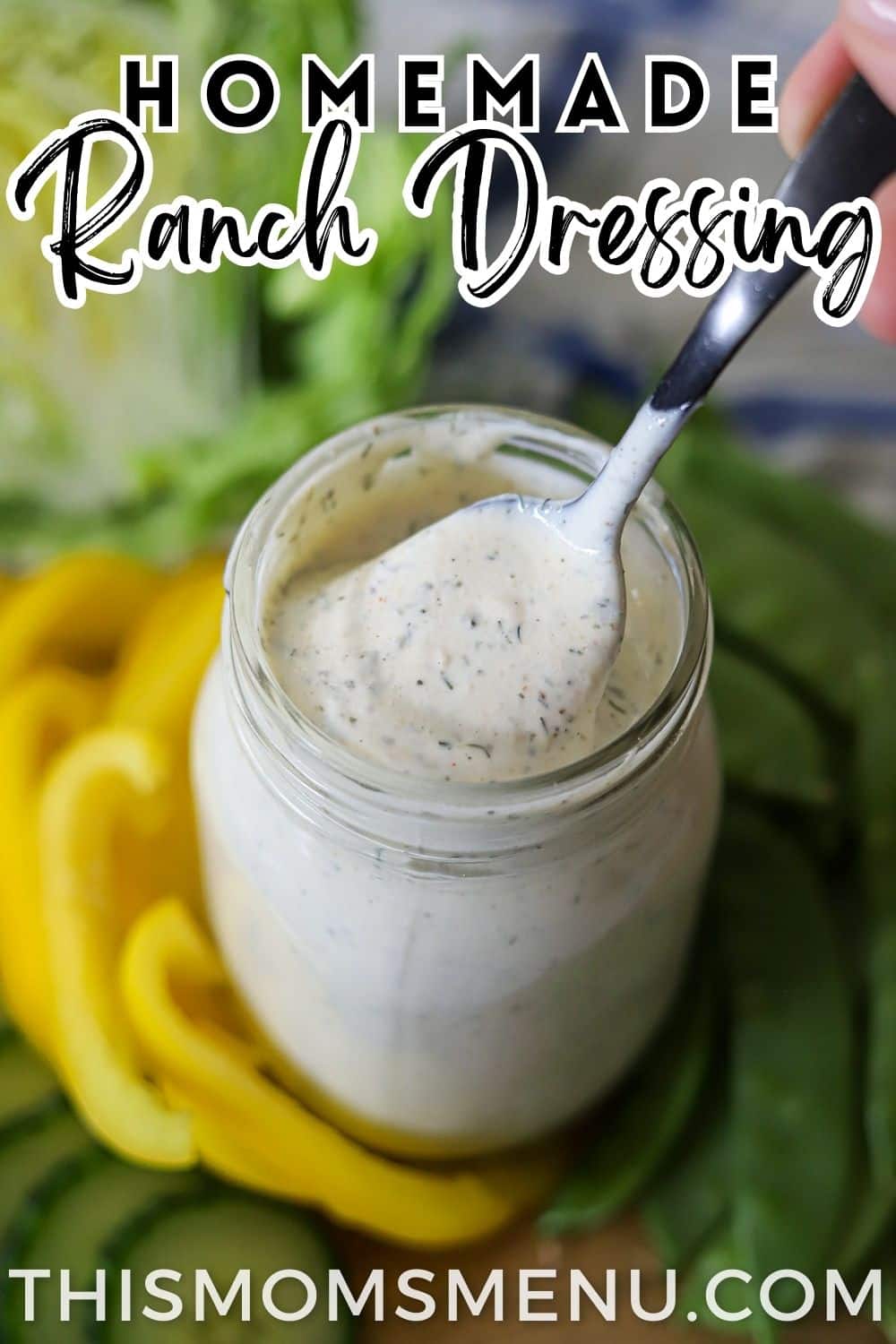a glass jar filled with homemade restaurant ranch dressing
