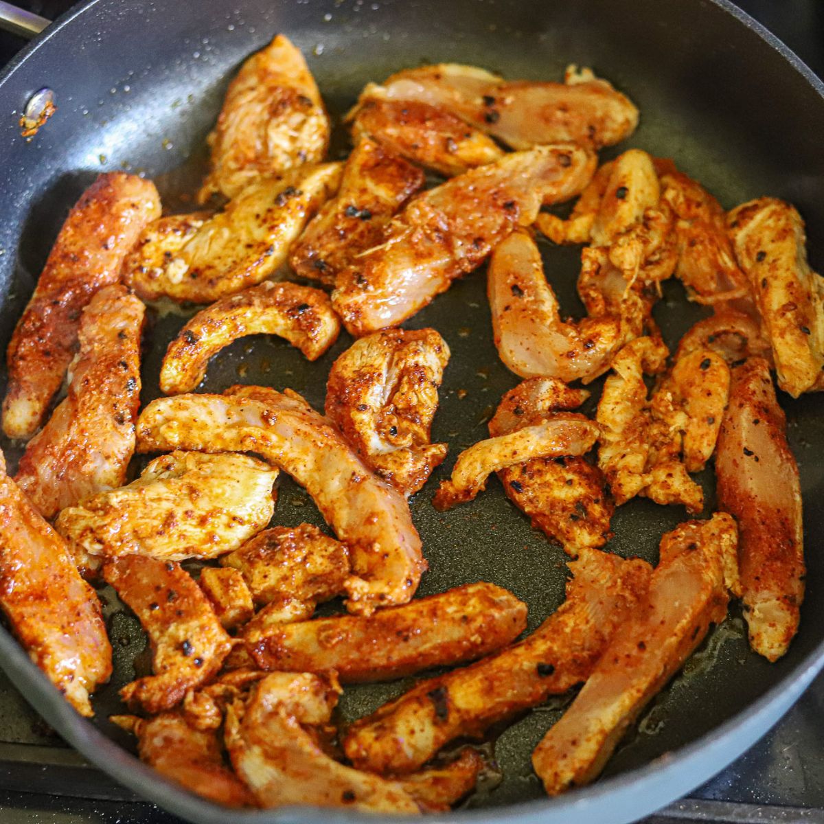 chicken for homemade tacos cooking in a skillet
